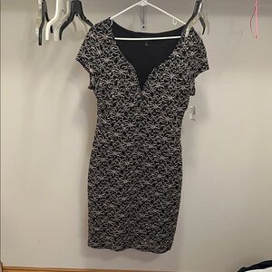 Elegant Black and gold sequin dress with subtle red sparkle